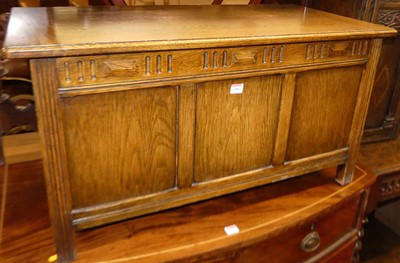 Lot 1280 - An oak three panelled hinge topped blanket...