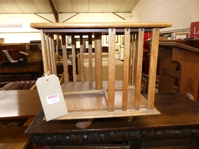 Lot 1282 - A blond oak four division square table-top...