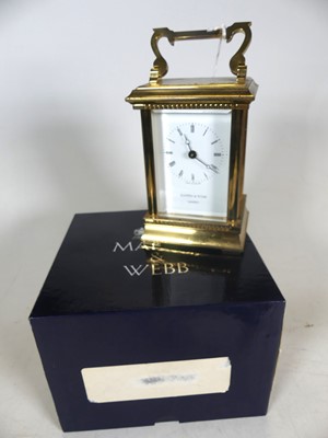 Lot 461 - A Mappin & Webb lacquered brass carriage clock,...