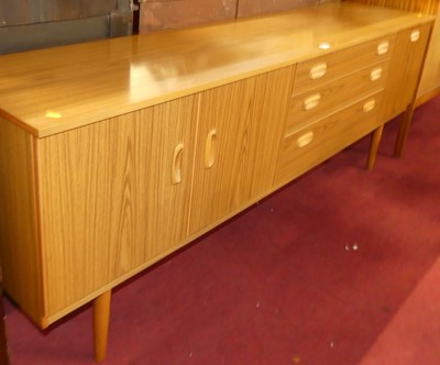 Lot 1289 - A 1960s laminate teak effect long sideboard, w....