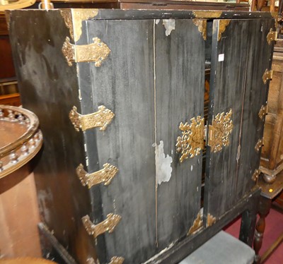 Lot 1297 - An Oriental black painted and floral engraved...