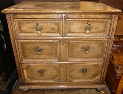 Lot 1299 - A Jacobean style oak chest of three long...
