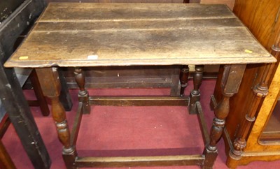 Lot 1300 - An 18th century joined plank topped oak side...