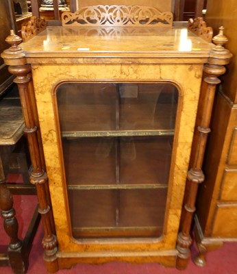 Lot 1302 - A mid-Victorian figured walnut single door...