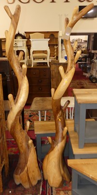 Lot 1312 - Two contemporary carved hardwood hall-trees,...