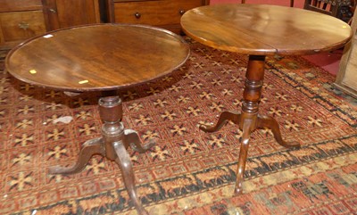 Lot 1324 - Two George III mahogany circular tilt-top...