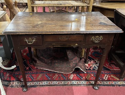 Lot 1346 - A circa 1800 oak three-drawer lowboy, w.89cm;...
