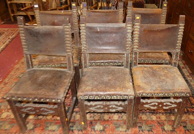 Lot 1366 - A set of six Spanish oak framed tan leather...
