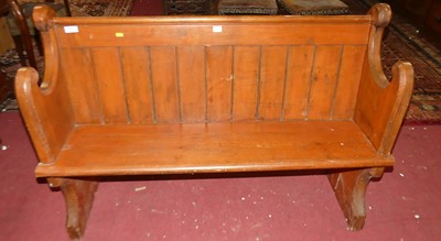 Lot 1371 - A stained pine three-seat church pew, w.127cm