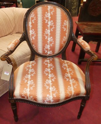 Lot 1388 - A circa 1900 French walnut framed open elbow...