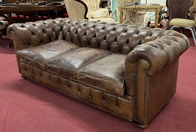 Lot 1401 - A tan leather buttonback upholstered...