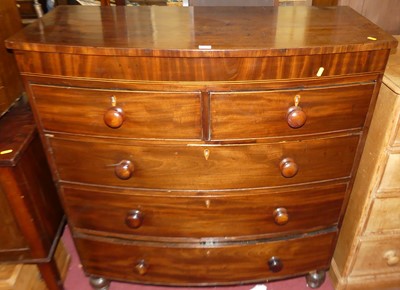Lot 1410 - A Regency mahogany bowfront chest of two short...