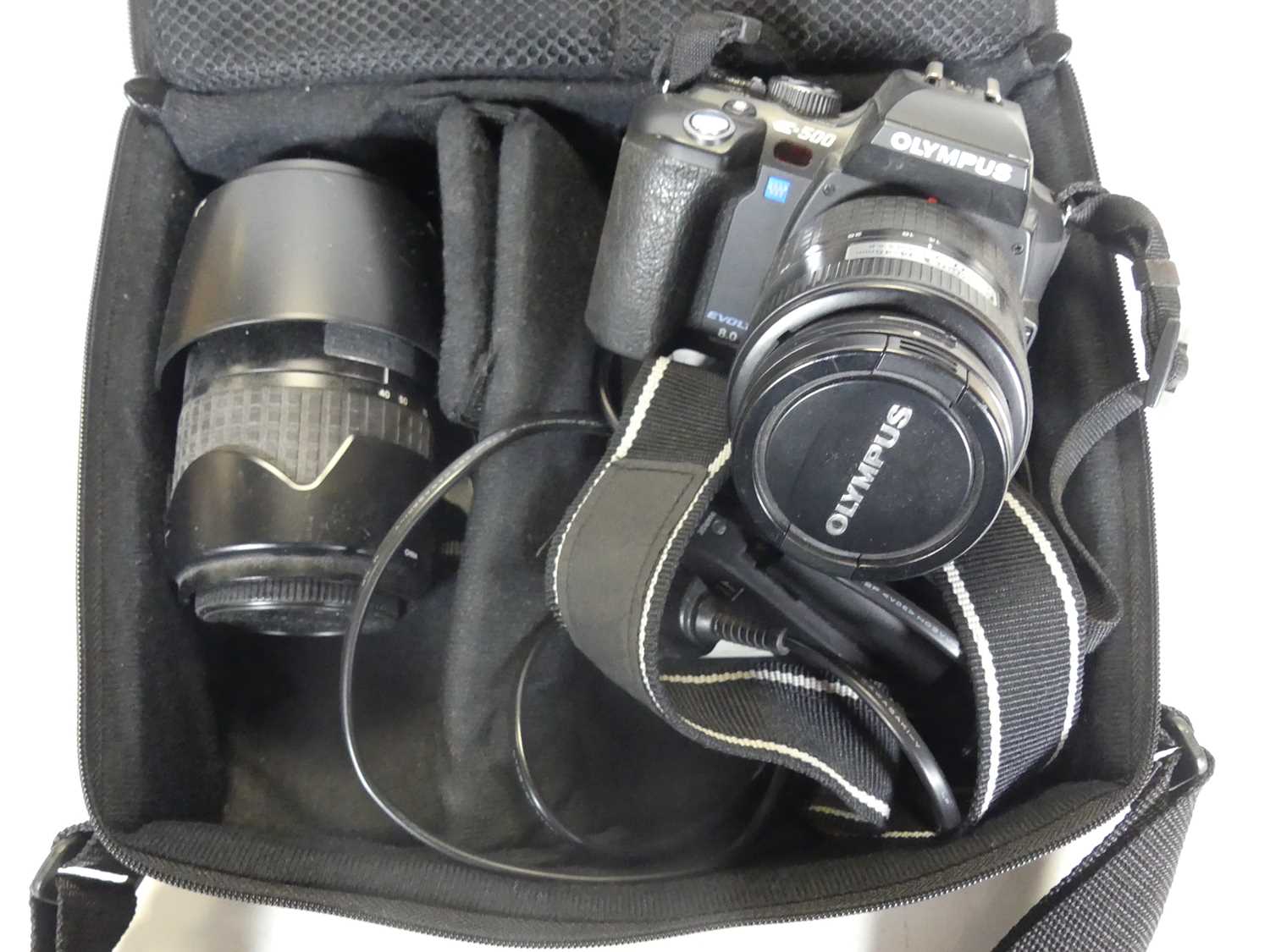 Lot 505 - An Olympus E500 digital camera, together with...