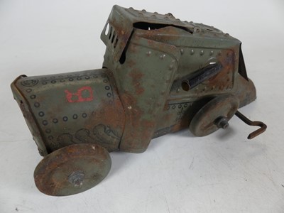 Lot 489 - A collection of tin plate toys to include...