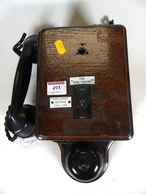 Lot 493 - An early 20th century bakelite stained wooden...