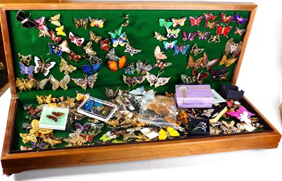 Lot 384 - A large collection of brooches in the form of...