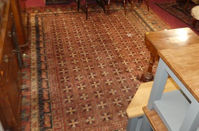 Lot 1446 - A Super Kashan machine-woven red ground carpet,...