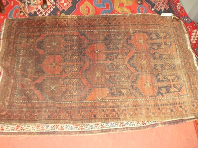 Lot 1448 - A Turkish woollen red ground rug (badly...