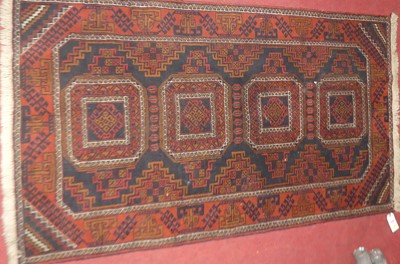Lot 1449 - An Afghan Belouch blue ground woollen rug, 95...