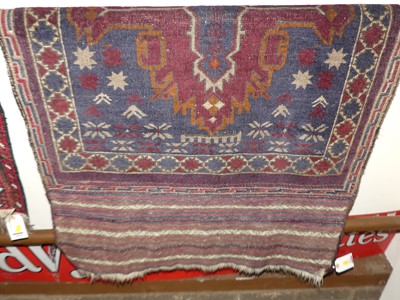 Lot 1459 - A Caucasian woollen blue ground rug, having...