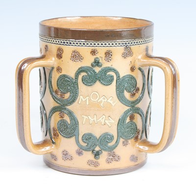 Lot 2056 - A Doulton Lambeth stoneware tyg, on a buff...