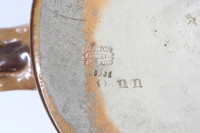 Lot 2056 - A Doulton Lambeth stoneware tyg, on a buff...