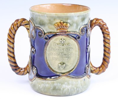 Lot 2057 - A Royal Doulton stoneware loving cup, circa...