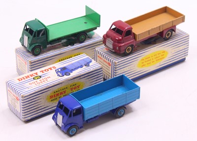 Lot 1359 - Dinky Toys group of three playworn haulage...