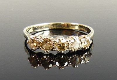 Lot 2256 - A white metal diamond half eternity ring,...