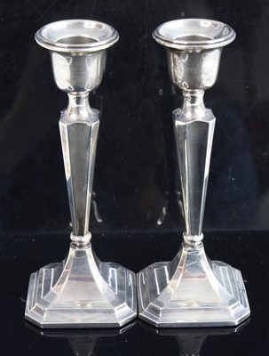 Lot 191 - A pair of George V silver candlesticks, each...