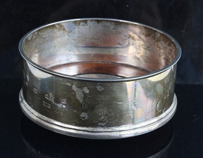 Lot 194 - A modern silver bottle coaster, of typical...