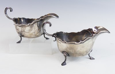 Lot 2117 - A pair of George V silver sauceboats, each...