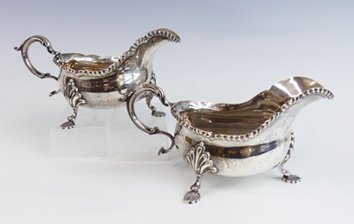 Lot 2166 - A pair of George VI silver gravy boats, each...