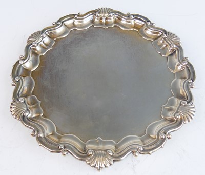 Lot 2172 - A George V silver card waiter, of shaped...