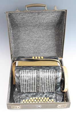 Lot 1383 - A Hohner Club II B melodeon with eight bass...