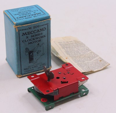Lot 652 - Meccano M209 X series clockwork motor, in red...
