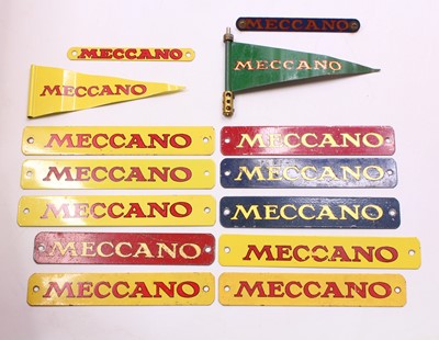 Lot 618 - A small collection of Meccano name badge, in...