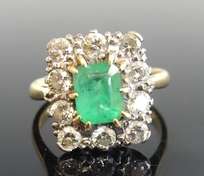 Lot 2259 - A yellow and white metal, emerald and diamond...