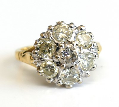 Lot 2309 - An 18ct yellow and white gold diamond circular...