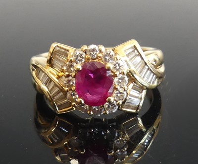 Lot 2264 - A yellow metal, ruby and diamond fancy cluster...