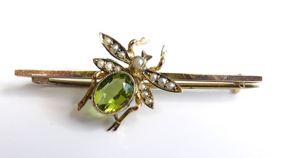 Lot 2233 - A yellow metal peridot and pearl winged insect...