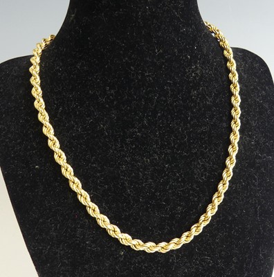 Lot 2315 - A 750 yellow metal ropetwist chain, with bolt...