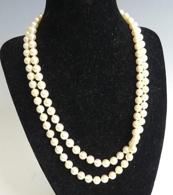 Lot 2246 - A two-row necklace of 58 and 54 uniform...