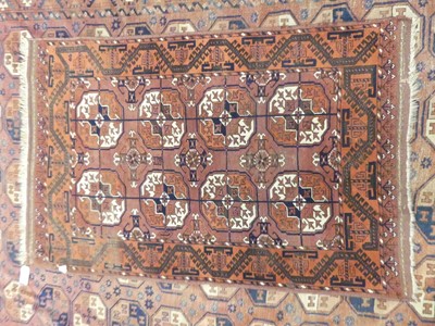 Lot 1123 - A Persian woollen Ersari rug, decorated with...