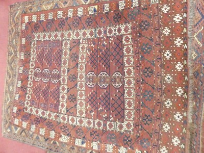 Lot 1125 - A Persian Ersari Ensi rug, having two boxed...