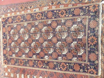 Lot 1122 - An Afghan woollen Beluchi rug, the deep blue...