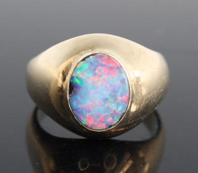 Lot 260 - A 9ct gold and cabochon opal set ring, size O,...
