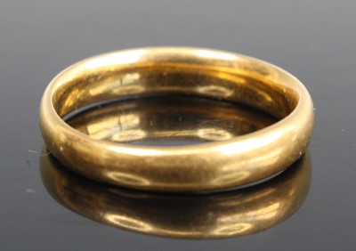 Lot 262 - A 22ct gold court shaped wedding band, sponsor...