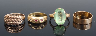 Lot 271 - An 18ct gold ruby set three-stone ring (one...