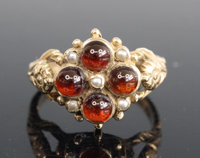 Lot 273 - A 9ct gold cabochon garnet and seed pearl set...